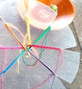 Tip: You can even make your own kumihimo disk using cardboard or thick plastic! Cut small notches around the edge — just like this — and it works beautifully.