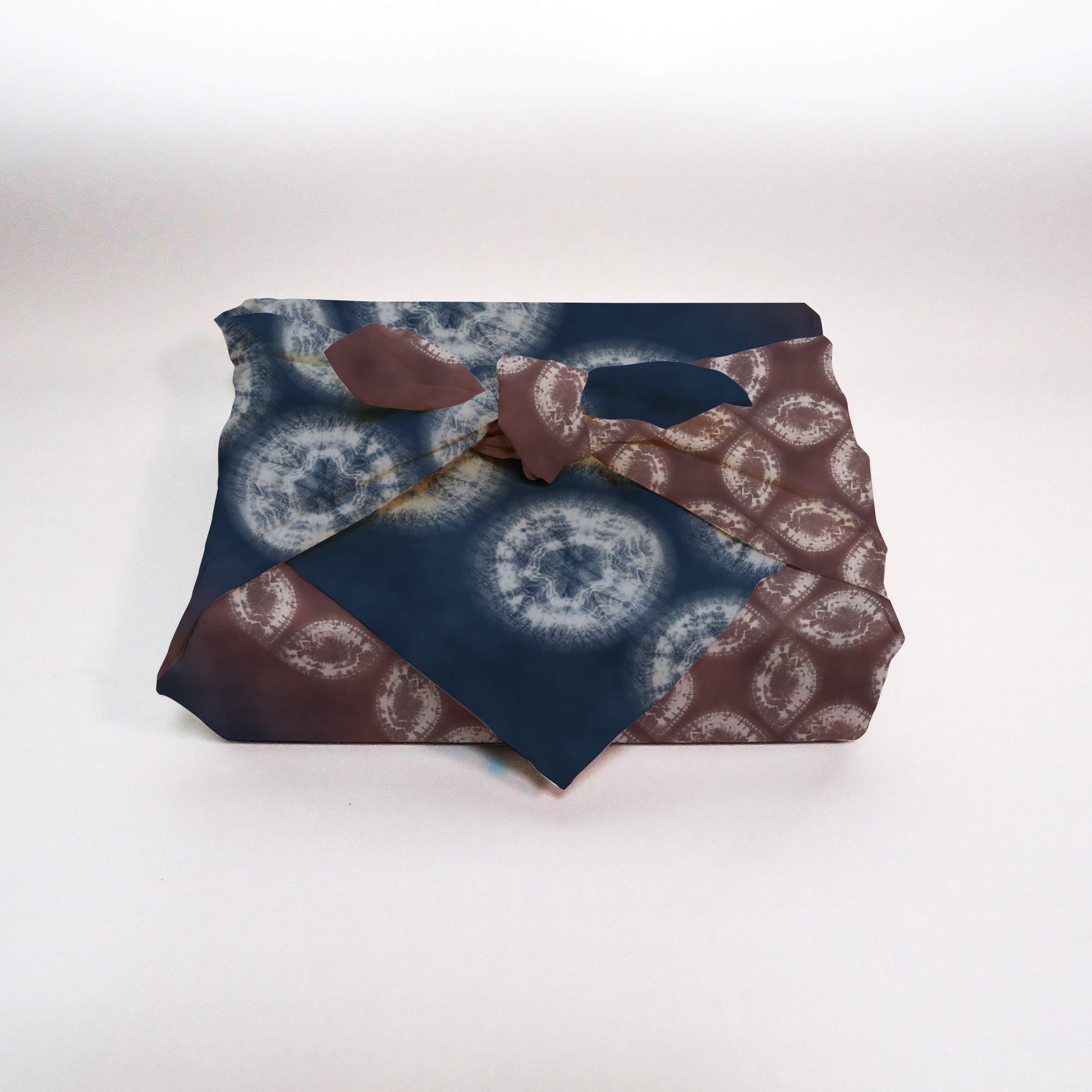 Furoshiki mockup showing patterned fabric wrapped in traditional style