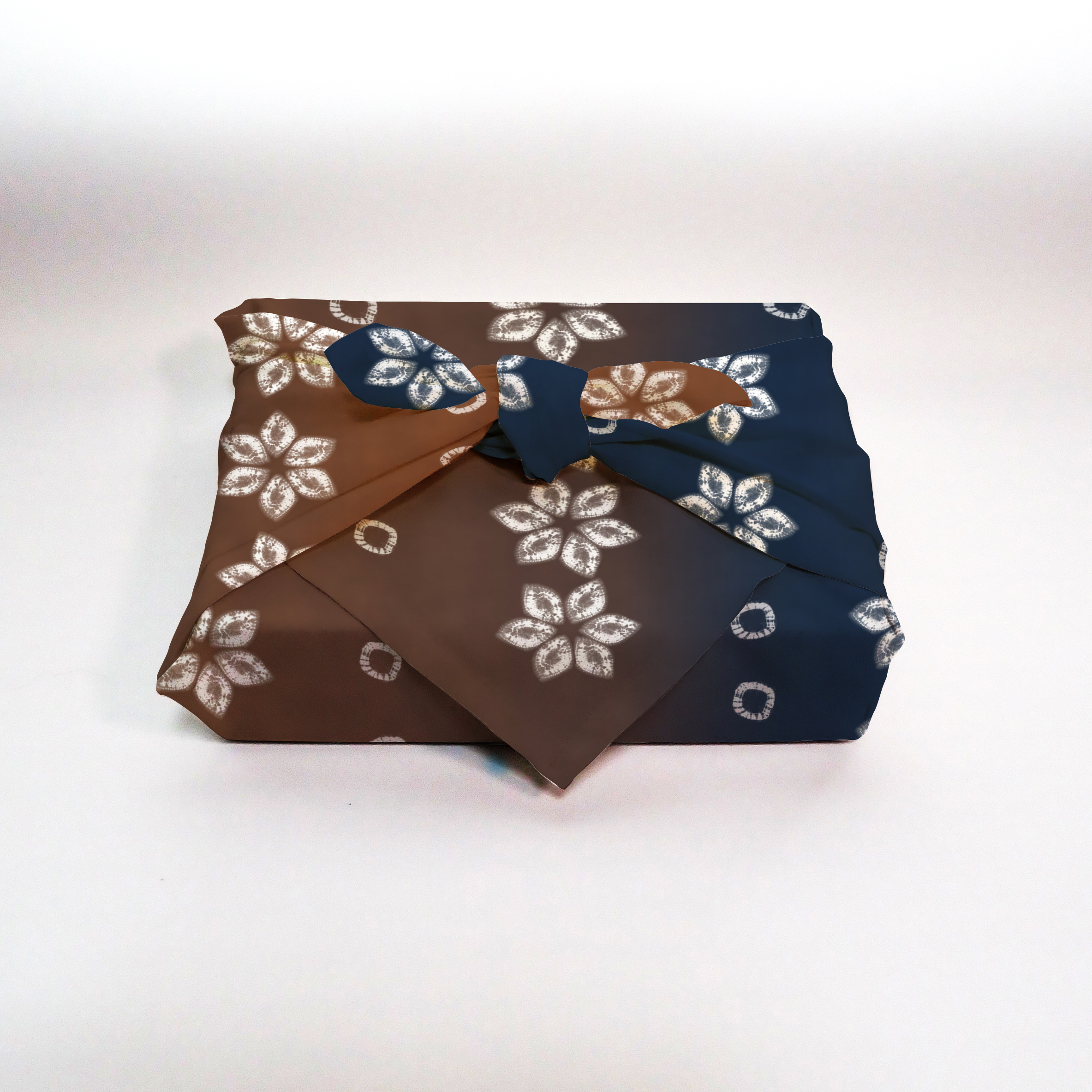 Furoshiki mockup showing patterned fabric wrapped in traditional style