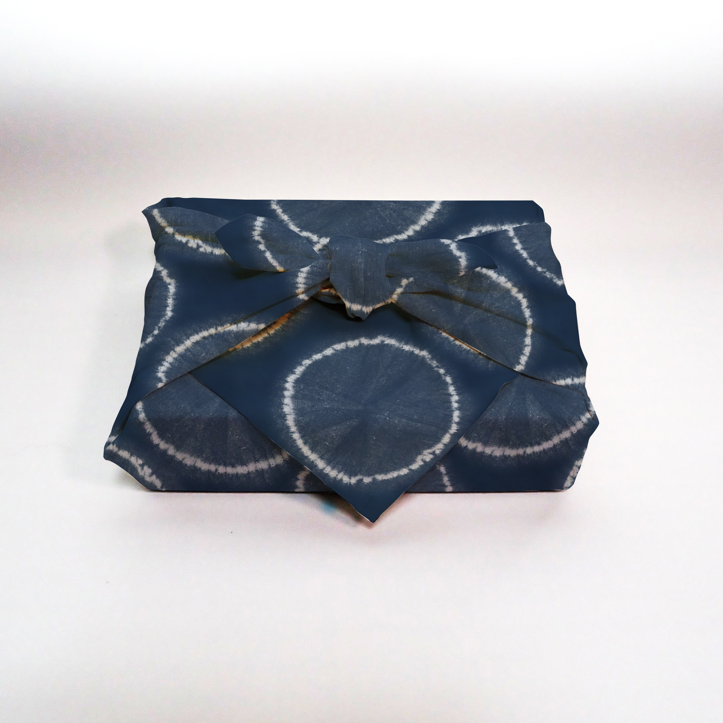 Furoshiki mockup showing patterned fabric wrapped in traditional style