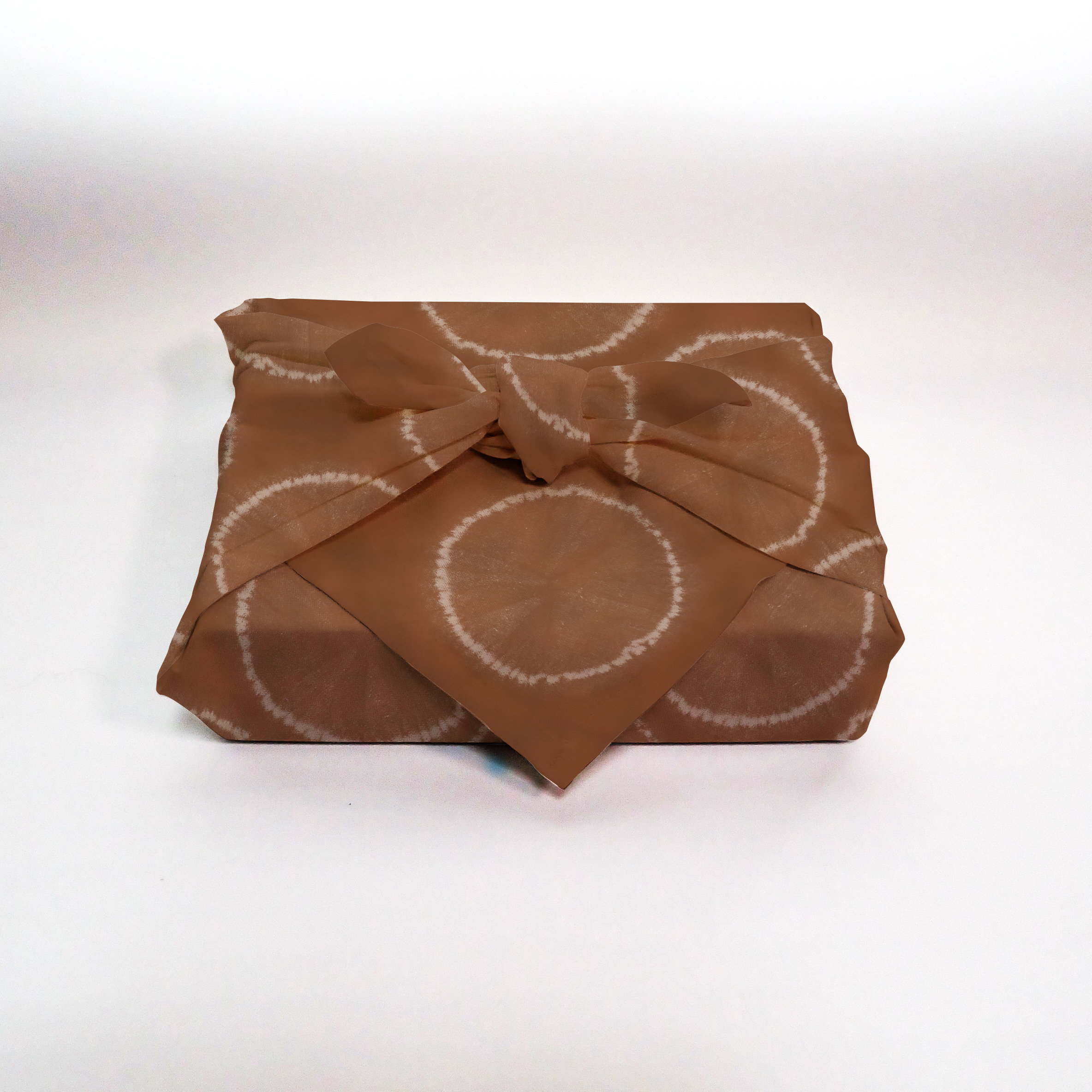 Furoshiki mockup showing patterned fabric wrapped in traditional style