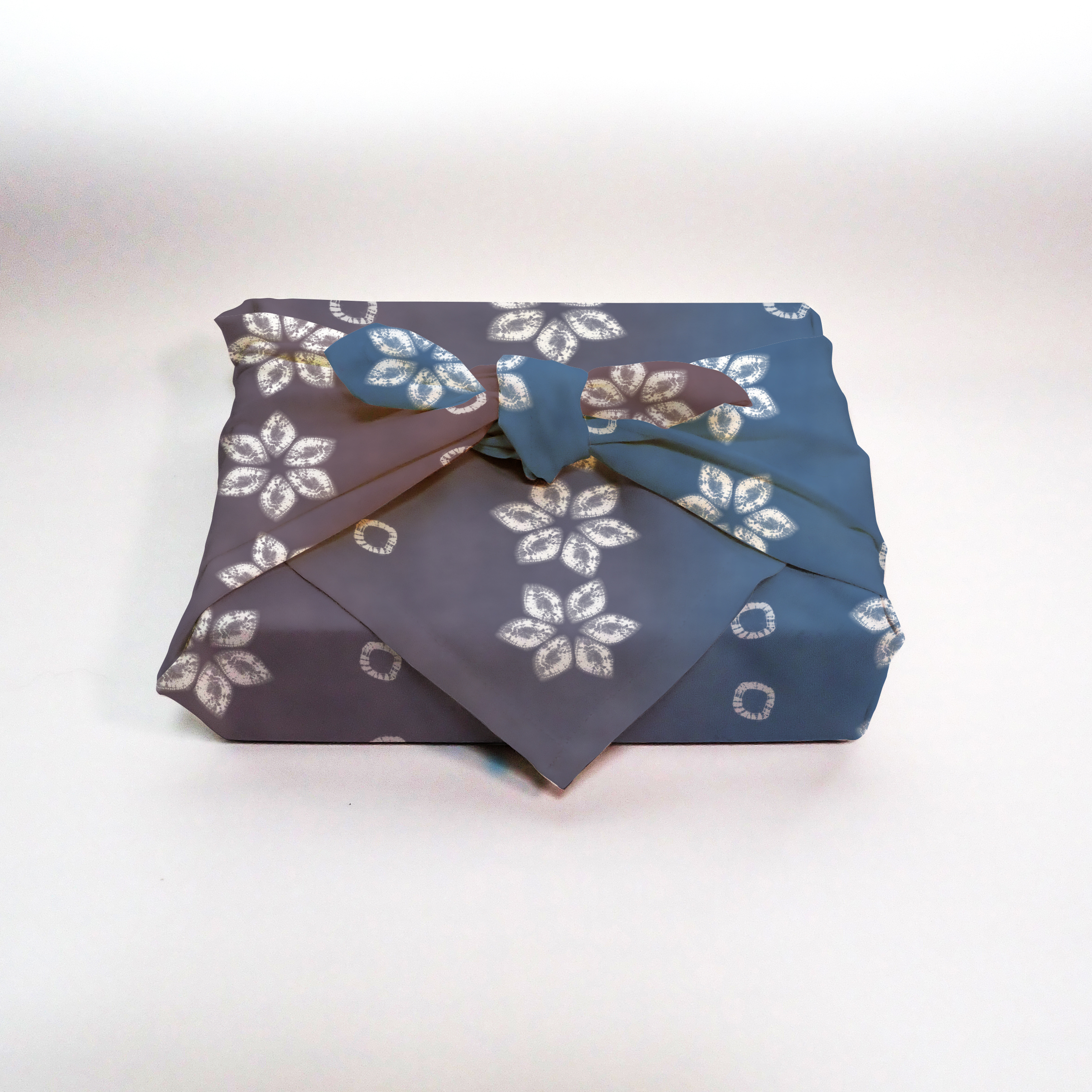 Furoshiki mockup showing patterned fabric wrapped in traditional style