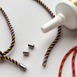 Jewelry-making supplies and adhesive.