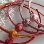 Colorful braided silk bracelets with sliding knots