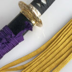 Japanese sword with sageo cord, showing traditional samurai craftsmanship and functional design