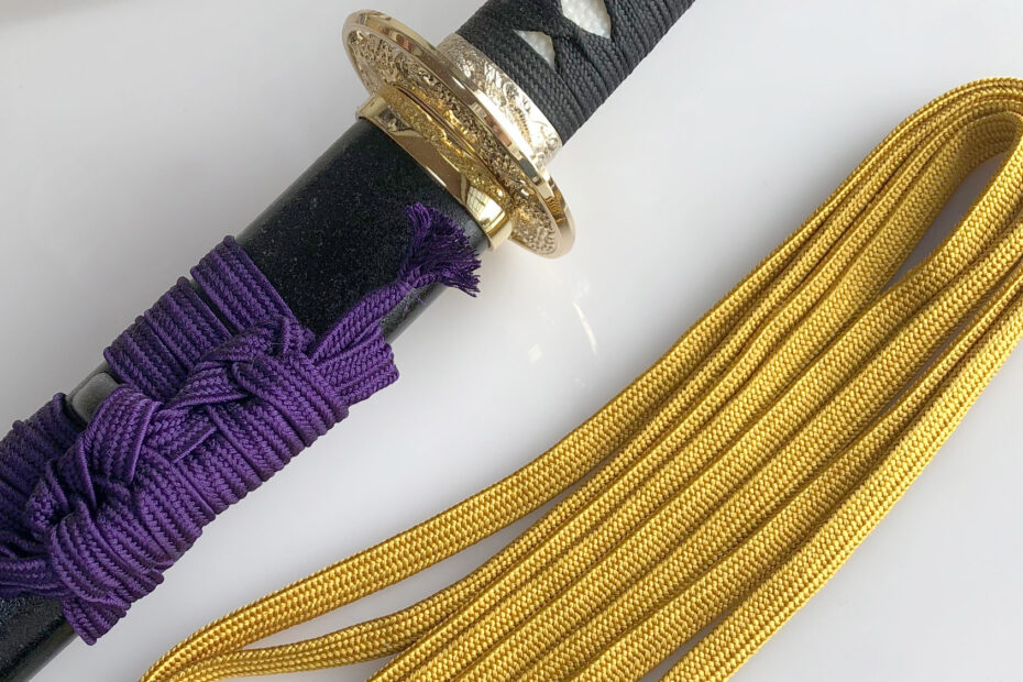 Japanese sword with sageo cord, showing traditional samurai craftsmanship and functional design