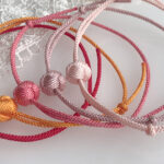 Colorful sliding knot bracelets displayed