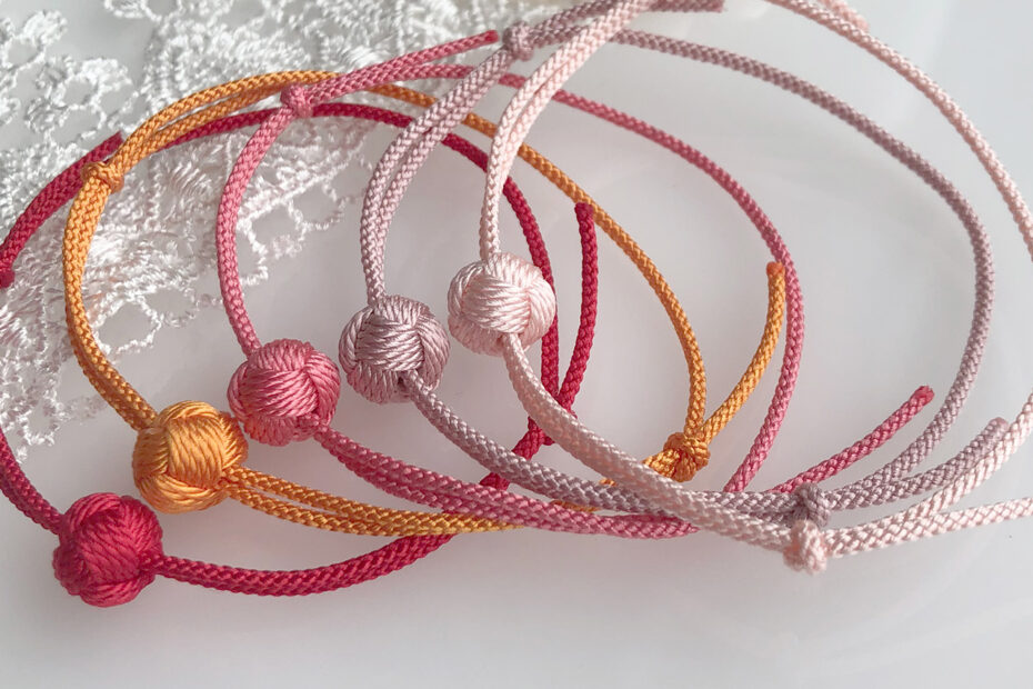 Colorful sliding knot bracelets displayed