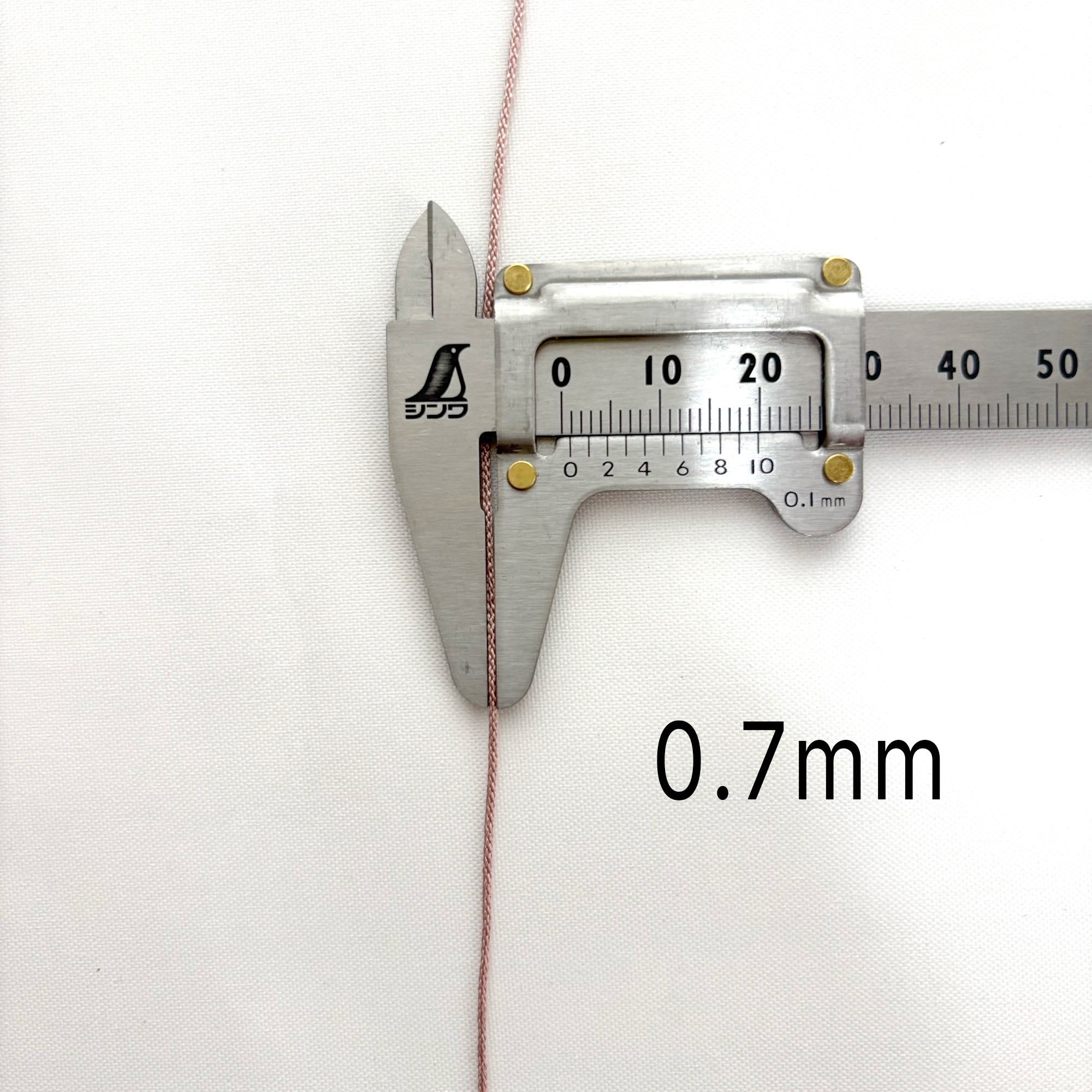 Caliper measuring 0.7mm thickness silk cord